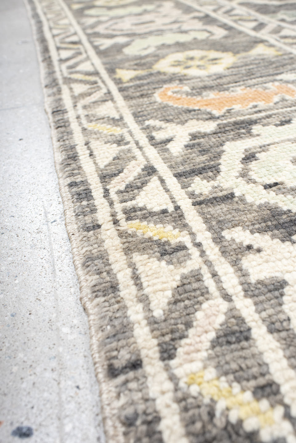 9' x 15' one-of-a-kind handmade vintage Oushak rug. Color palette: charcoal, ivory, sage, gold, peach, taupe, gray, black