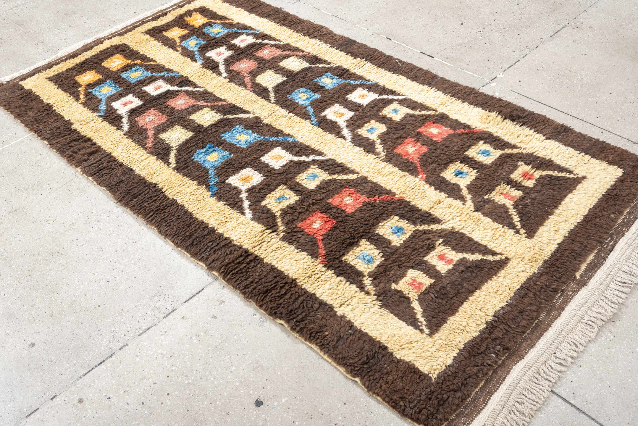 3' x 6' one-of-a-kind handmade vintage Tulu rug. Color palette: brown, ivory, sky_blue, coral, saffron, cream, light blue