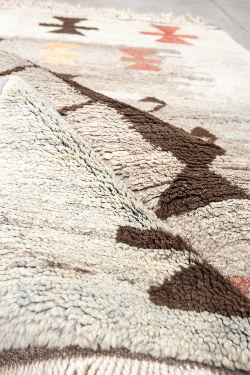 4' x 6' one-of-a-kind handmade vintage Moroccan rug. Color palette: ivory, brown, taupe, coral, gold, charcoal, peach, beige