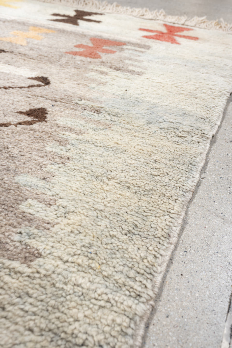 4' x 6' one-of-a-kind handmade vintage Moroccan rug. Color palette: ivory, brown, taupe, coral, gold, charcoal, peach, beige