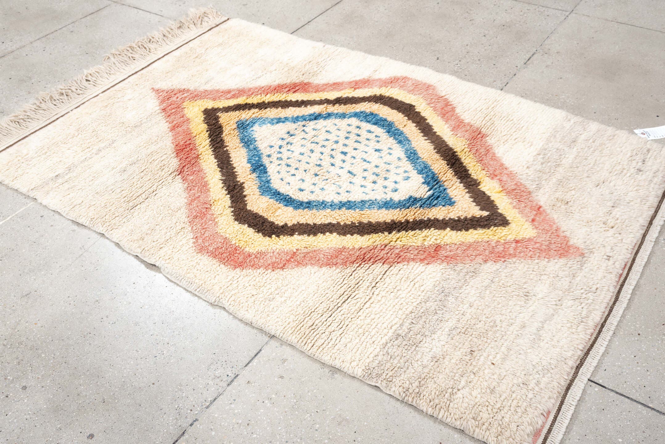 4' x 6' one-of-a-kind handmade vintage Moroccan small size rug. Color palette: ivory, rose, brown, blue, gold, peach, taupe