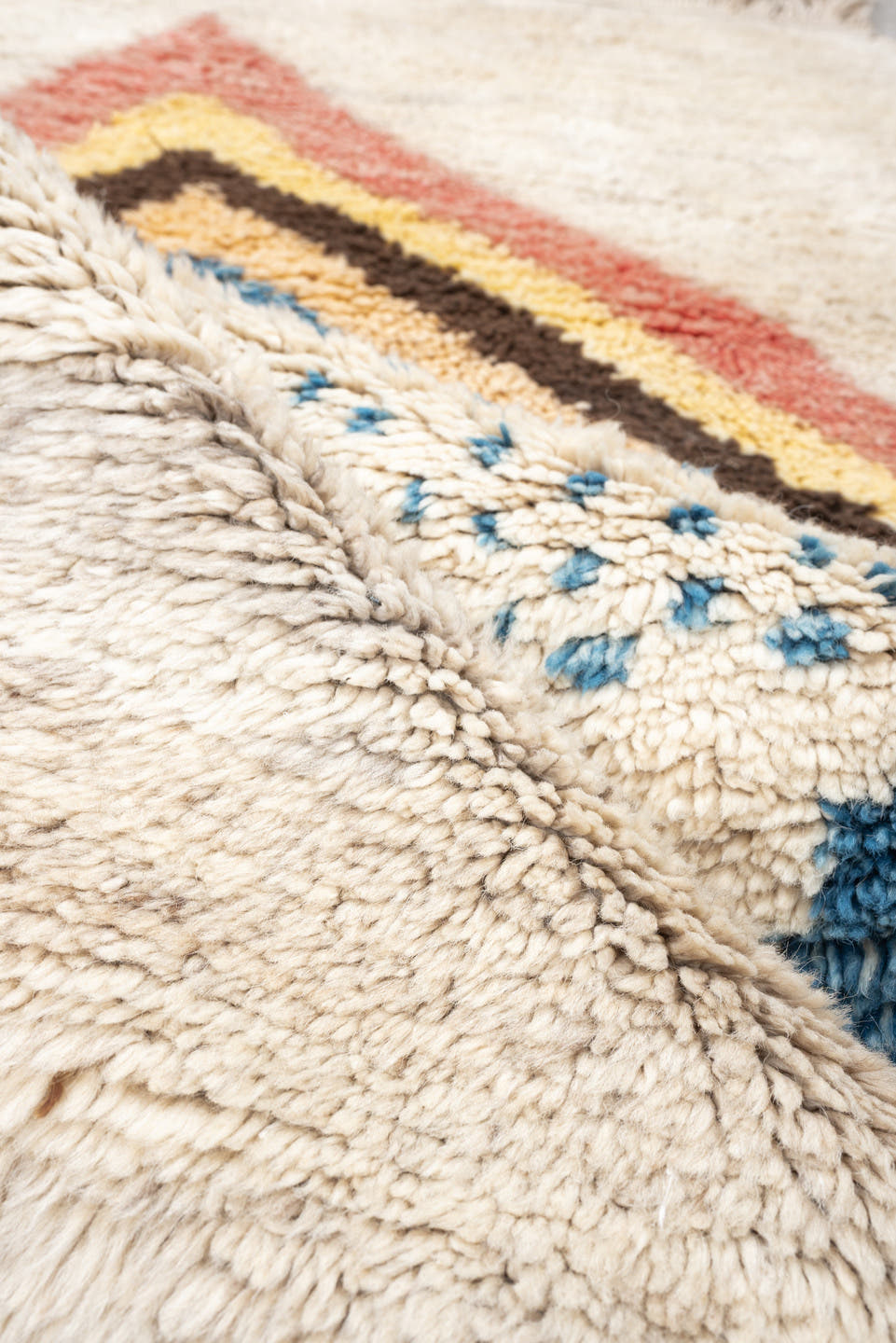 4' x 6' one-of-a-kind handmade vintage Moroccan small size rug. Color palette: ivory, rose, brown, blue, gold, peach, taupe