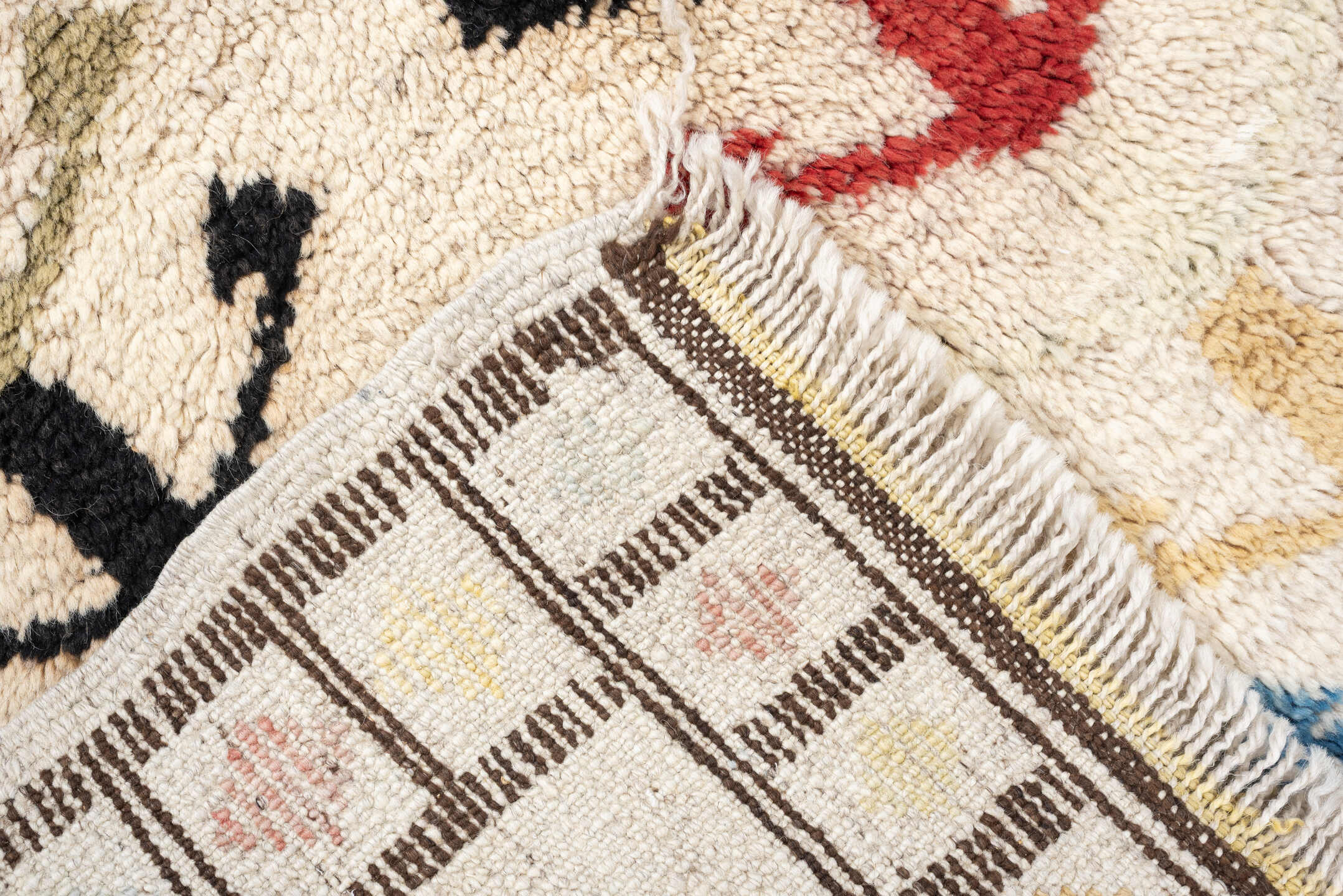 5' x 7' one-of-a-kind handmade vintage Tulu rug. Color palette: ivory, brown, sky blue, coral, blush, mustard, black, sage