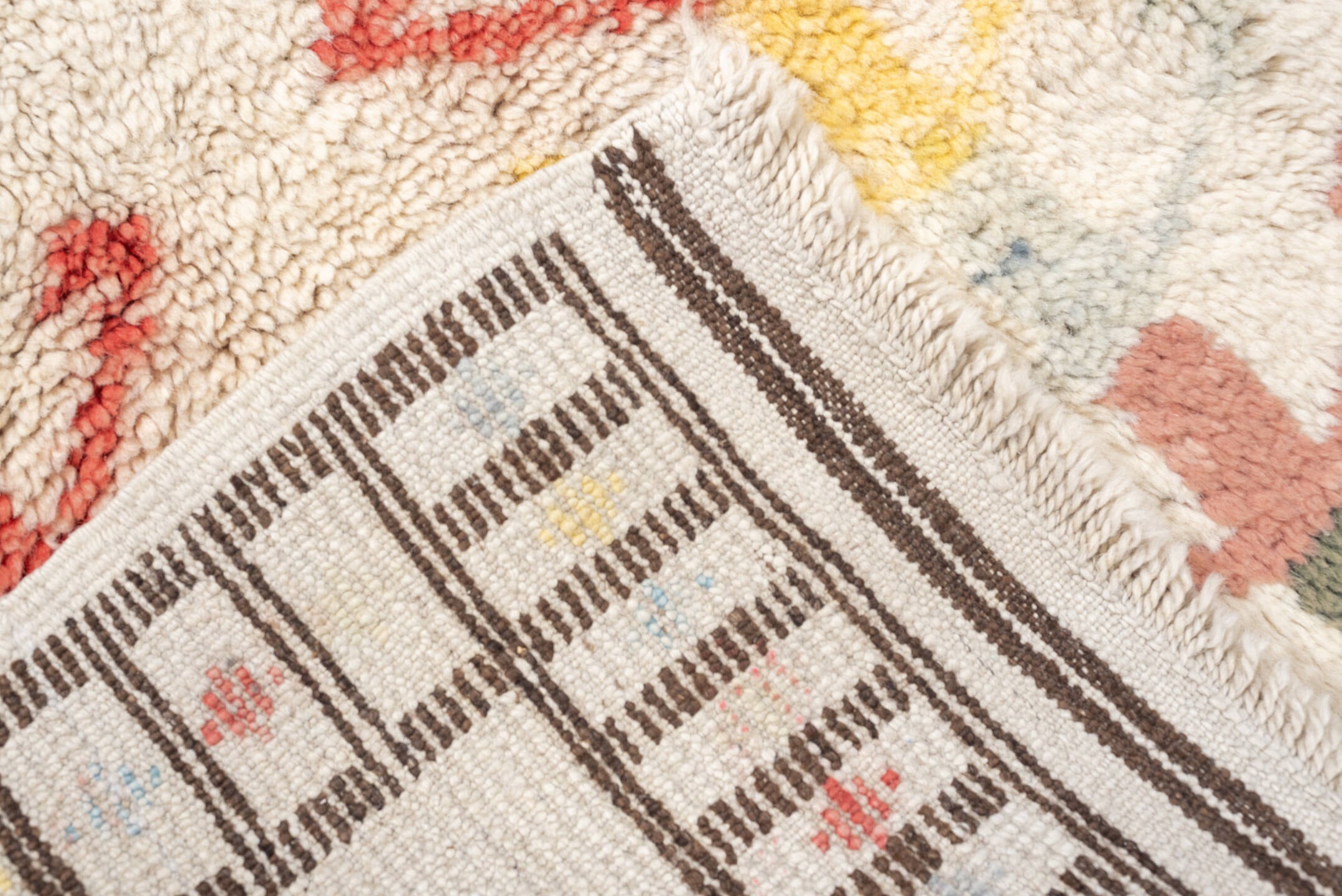 4' x 6' one-of-a-kind handmade vintage Moroccan small size rug. Color palette: ivory, brown, blue, coral, yellow, olive