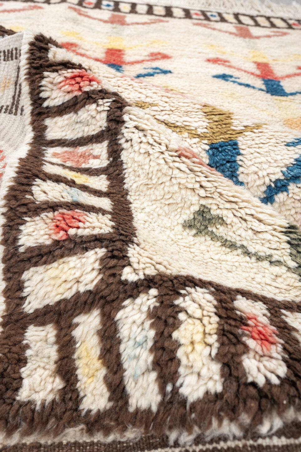 4' x 6' one-of-a-kind handmade vintage Moroccan small size rug. Color palette: ivory, brown, blue, coral, yellow, olive