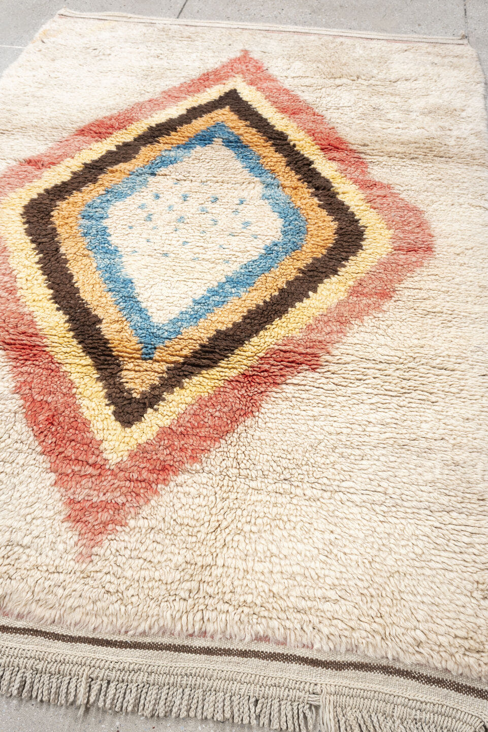 4' x 6' one-of-a-kind handmade vintage Tulu small size rug. Color palette: ivory, rose, brown, sky_blue, peach, gold, taupe