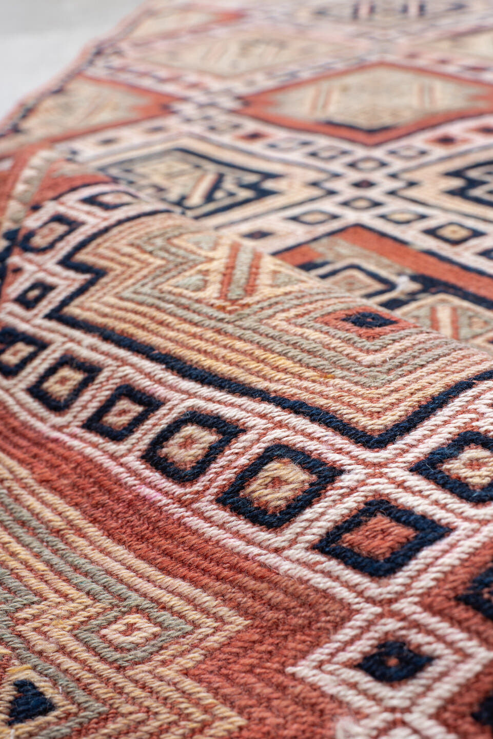 2' x 12' one-of-a-kind handmade vintage Jijim runner rug. Color palette: ivory, terra cotta, charcoal, rust, camel