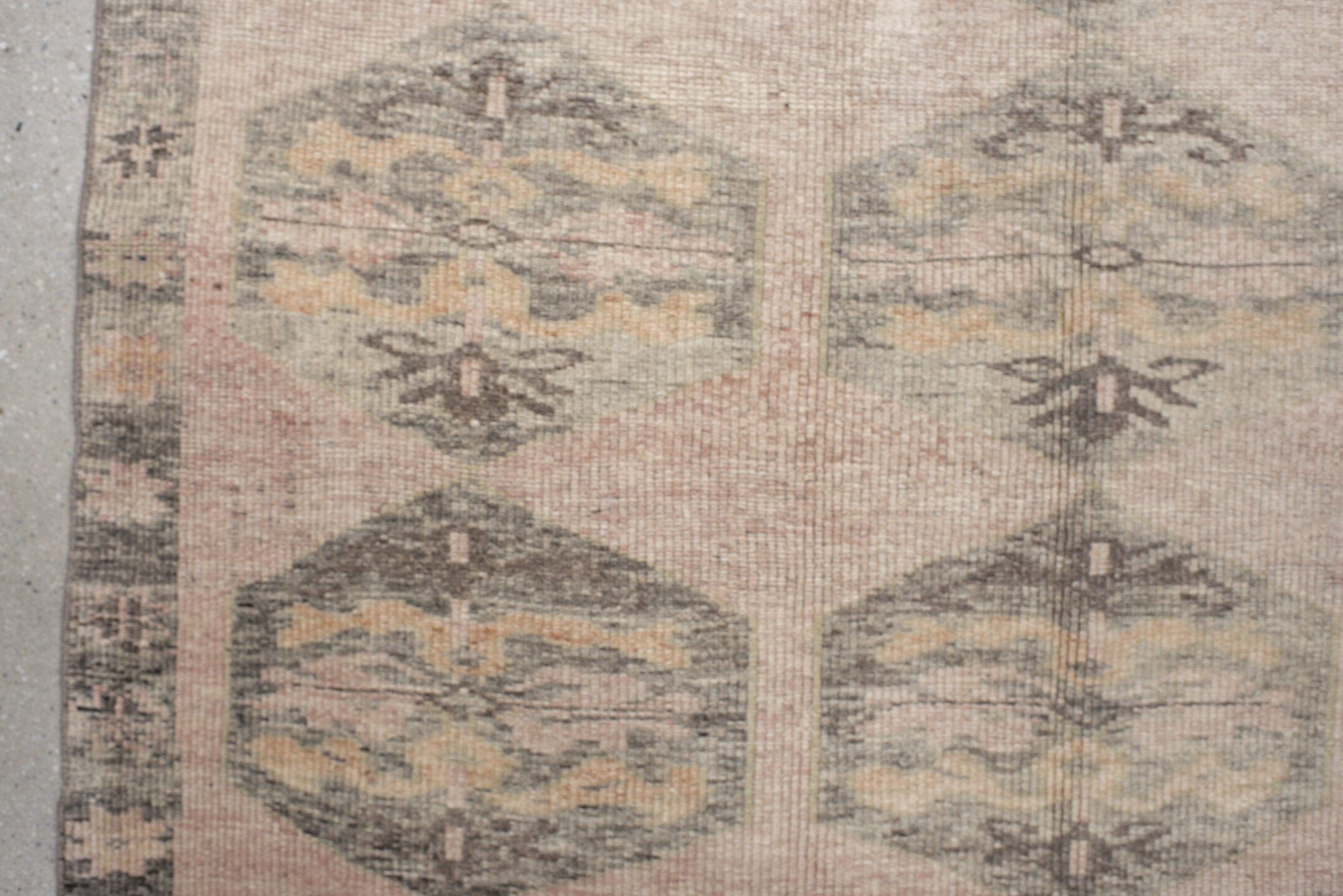 4' x 9' one-of-a-kind handmade vintage Kars runner rug. Color palette: brown, gray, light gray, off-white, orange, pink