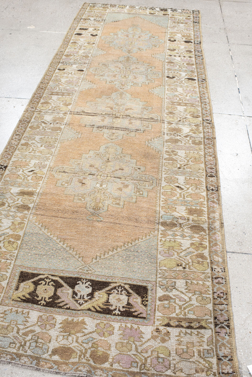 3' x 10' one-of-a-kind handmade vintage Oushak runner rug. Color palette: peach, ivory, taupe, sage, camel, charcoal, cream