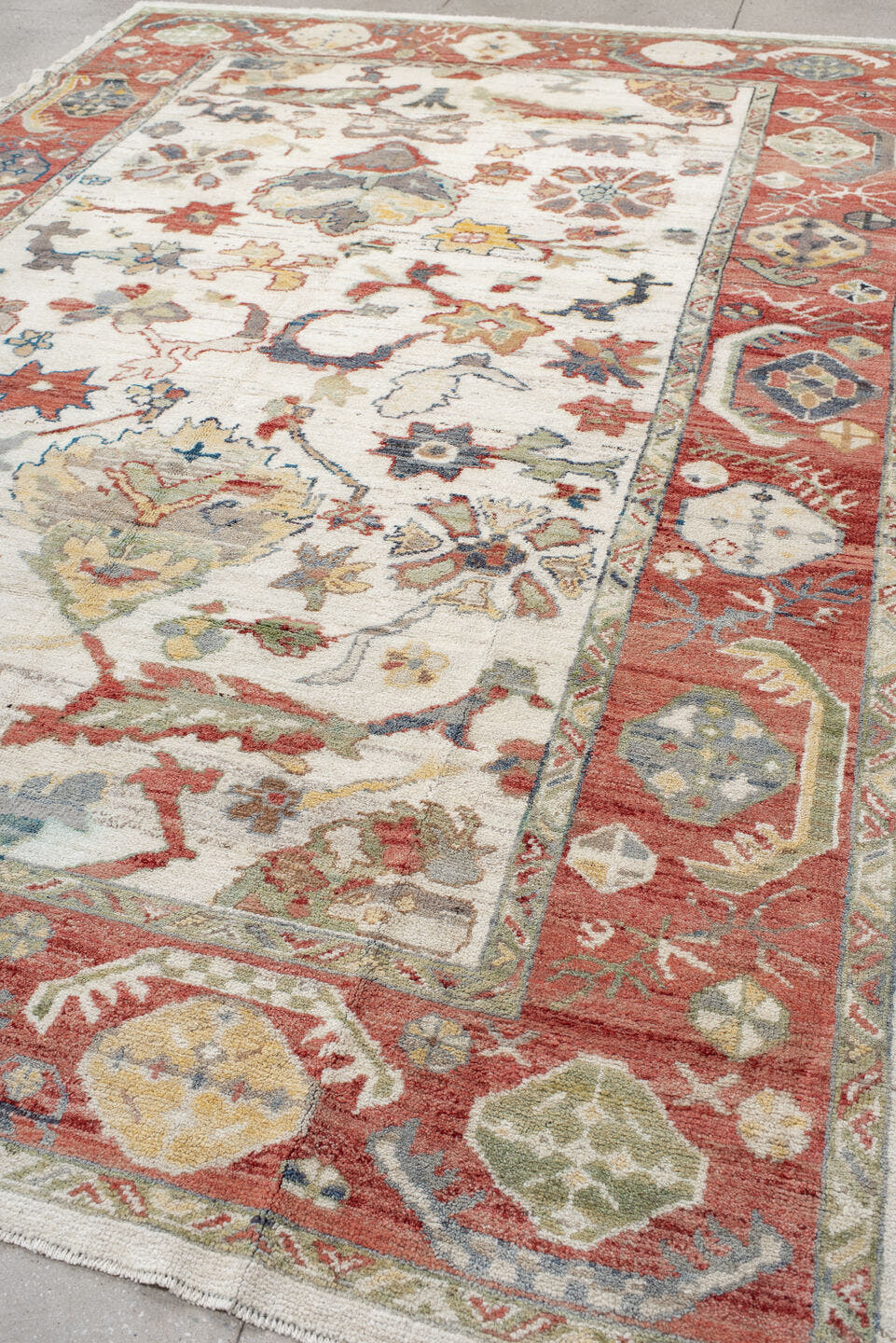 8' x 12' one-of-a-kind handmade vintage Oushak large size rug. Color palette: ivory, rust, sage, slate_blue, gold, coral