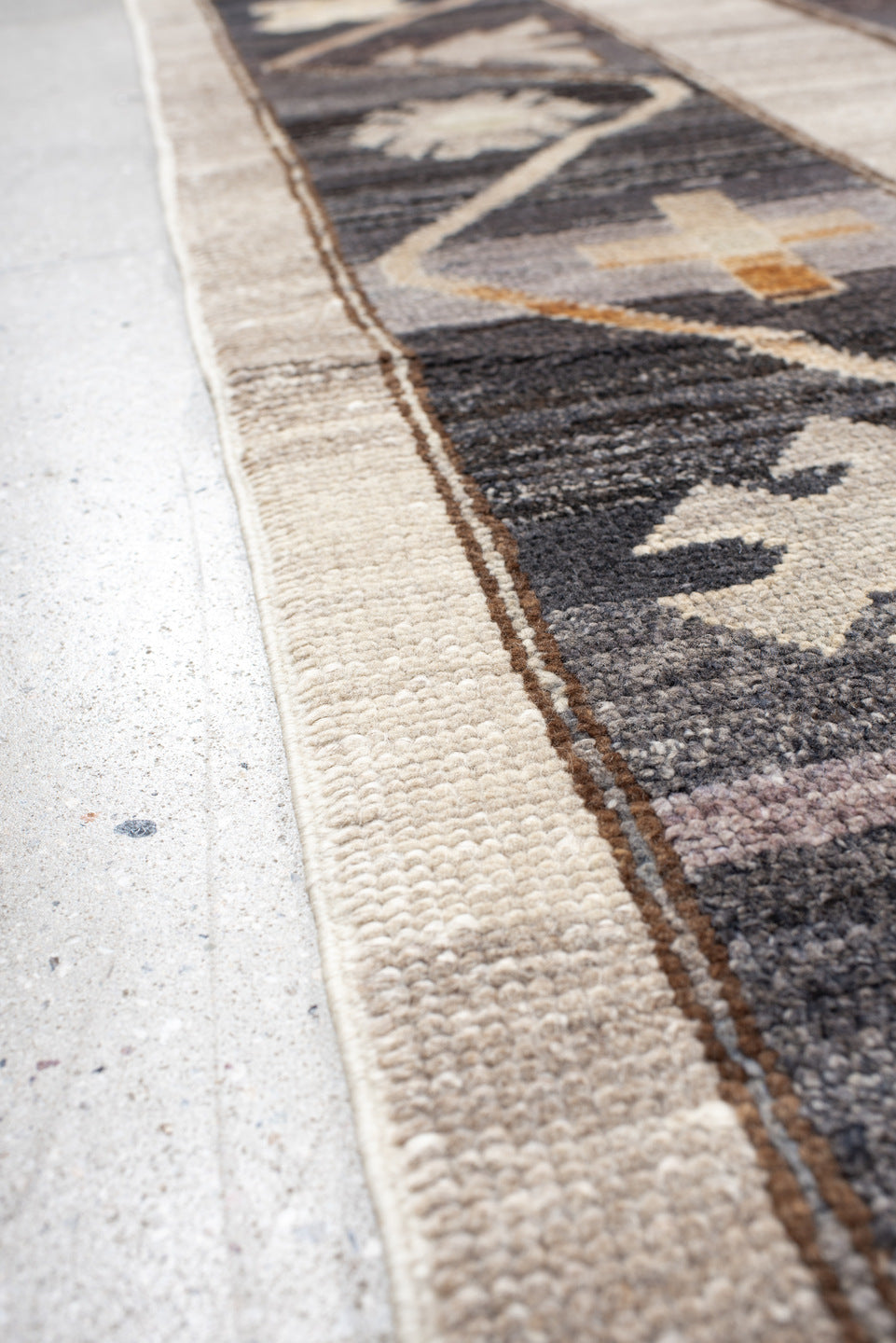 10' x 13' one-of-a-kind handmade vintage Kars large size rug. Color palette: ivory, charcoal, taupe, brown, slate, camel