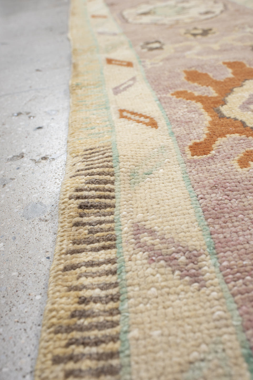 9' x 11' one-of-a-kind handmade vintage Oushak large size rug. Color palette: ivory, lavender, peach, pale gold, sky blue