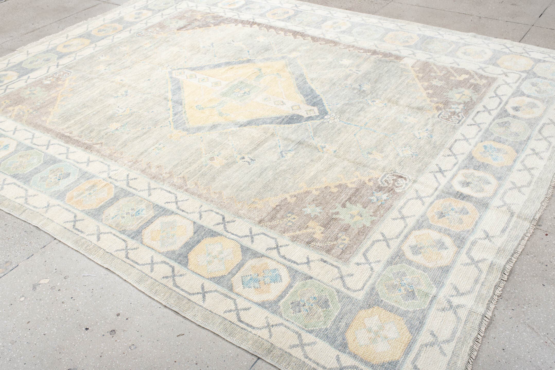 8' x 10' one-of-a-kind handmade vintage Oushak large size rug. Color palette: ivory, pale blue, taupe, sage, cream, beige
