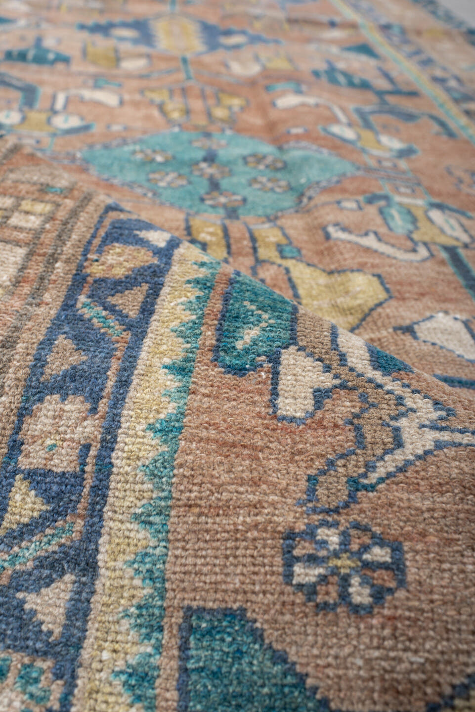 3' x 9' one-of-a-kind handmade vintage Lilian runner rug. Color palette: rose, teal, ivory, navy, camel, sage, taupe, pink