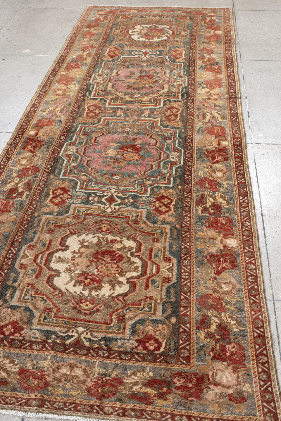 4' x 11' one-of-a-kind handmade vintage Baktiary runner rug. Color palette: ivory, rose, rust, slate, burgundy, taupe, sage
