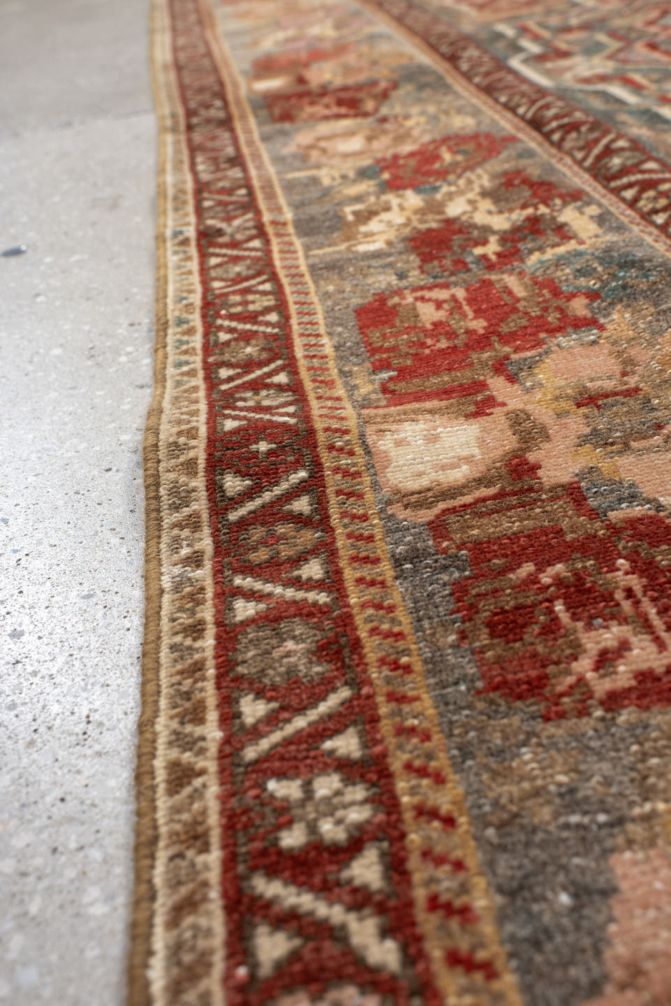 4' x 11' one-of-a-kind handmade vintage Baktiary runner rug. Color palette: ivory, rose, rust, slate, burgundy, taupe, sage