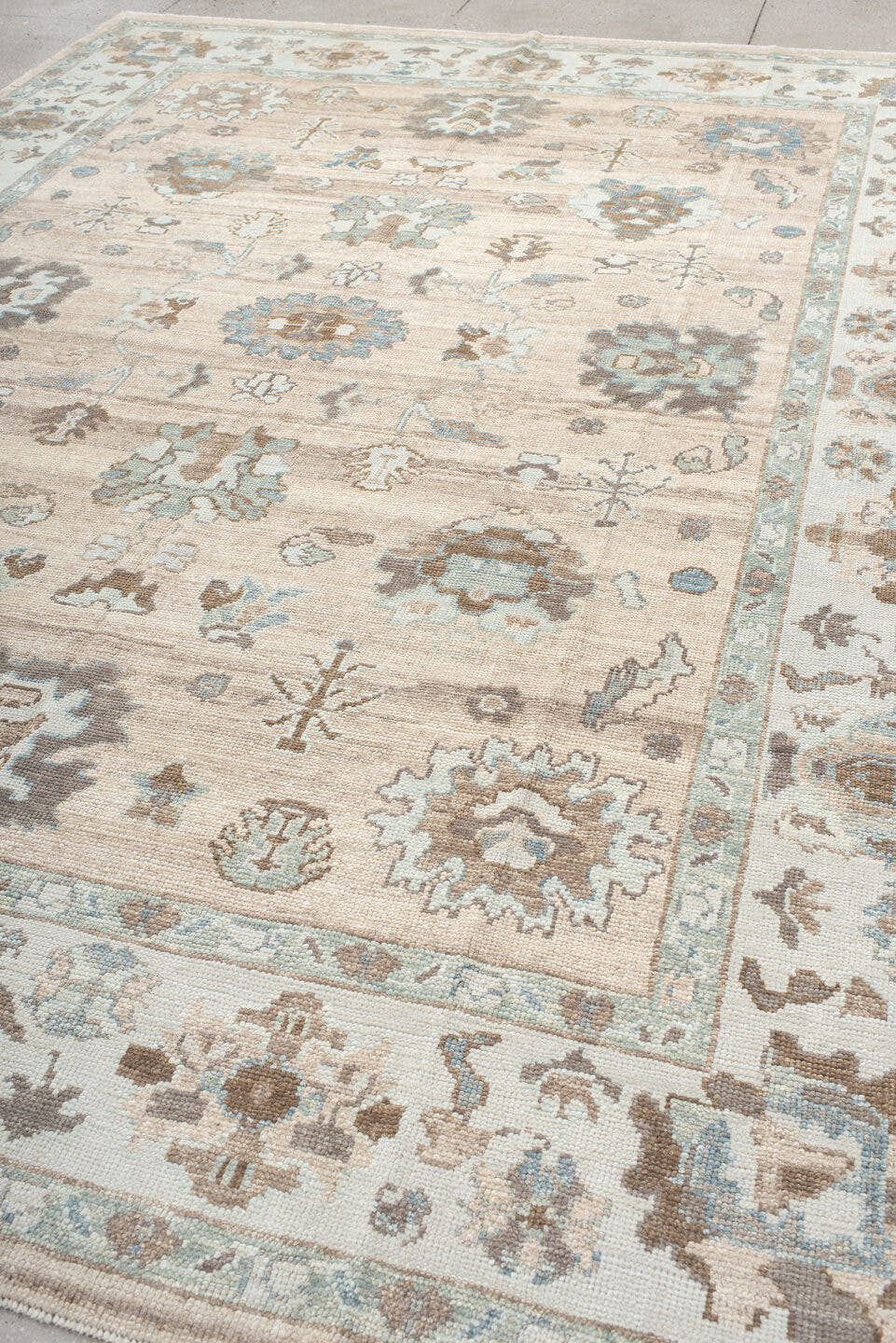 9' x 12' one-of-a-kind handmade vintage Oushak large size rug. Color palette: beige, ivory, light blue, taupe, brown, cream
