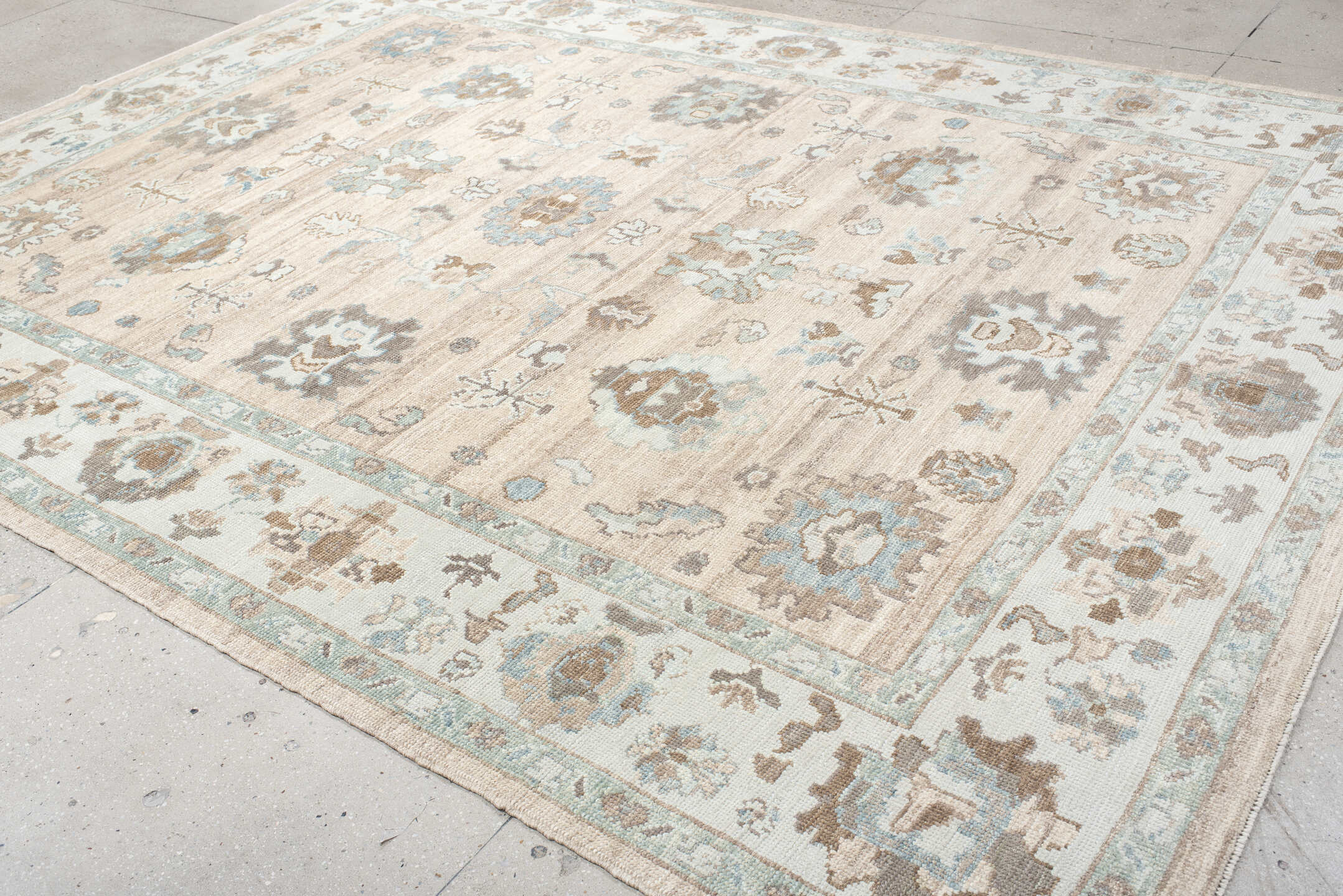 9' x 12' one-of-a-kind handmade vintage Oushak large size rug. Color palette: beige, ivory, light blue, taupe, brown, cream