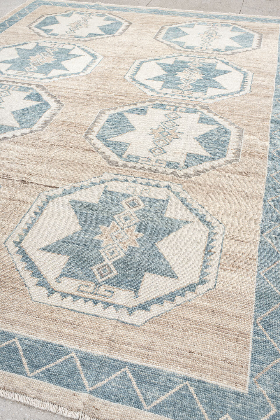 9' x 12' one-of-a-kind handmade vintage Oushak large size rug. Color palette: ivory, pale blue, taupe, beige, gray