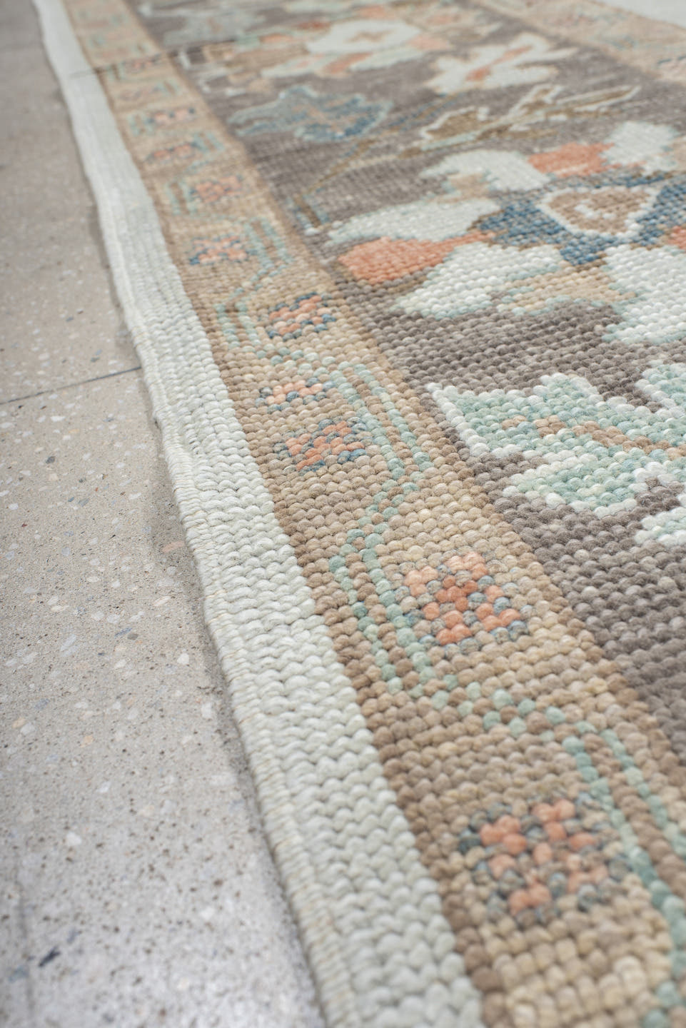 9' x 12' one-of-a-kind handmade vintage Oushak large size rug. Color palette: ivory, taupe, sage, muted blue, coral, brown