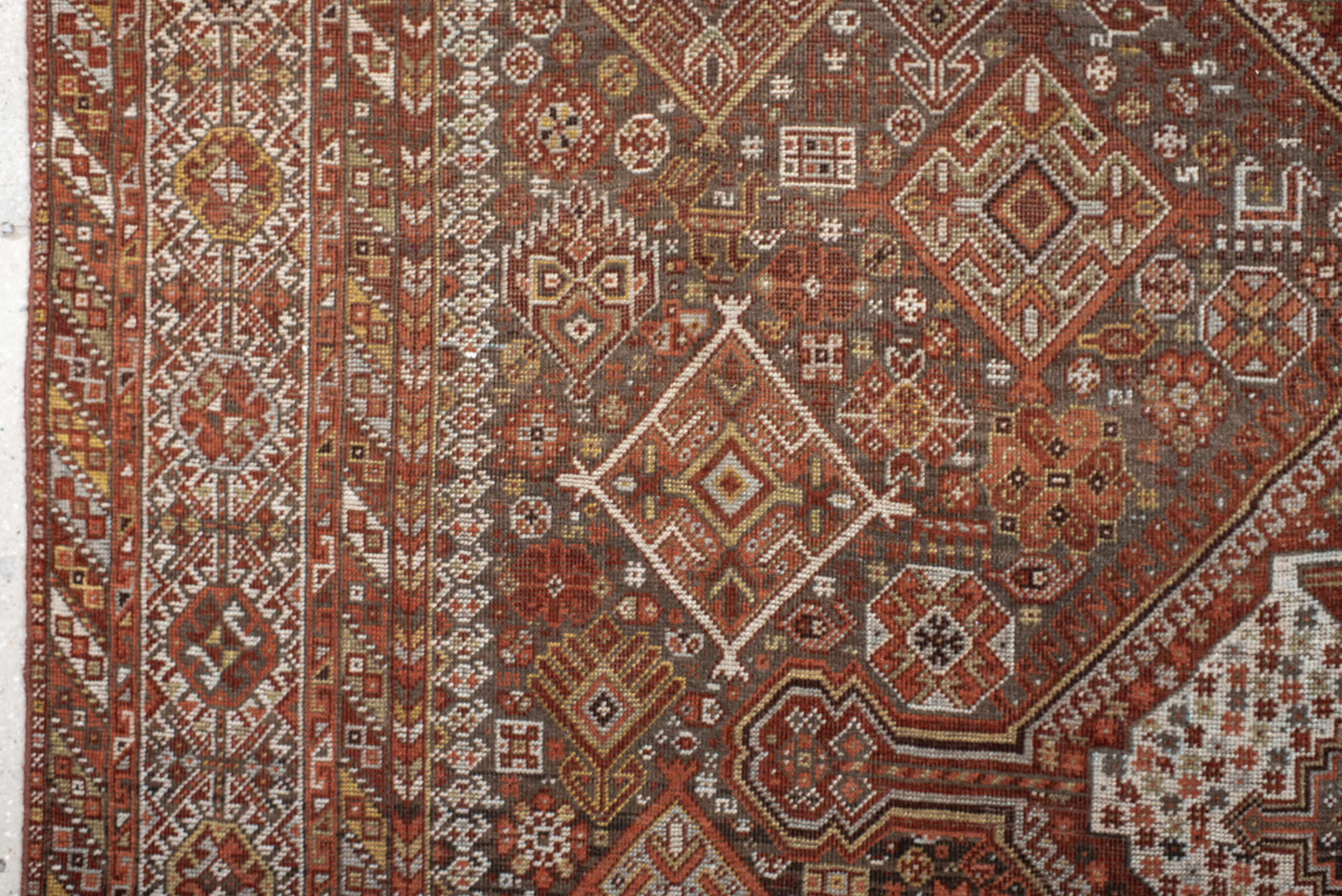 7' x 10' one-of-a-kind handmade antique Shiraz large size rug. Color palette: rust, ivory, brown, terra cotta, charcoal
