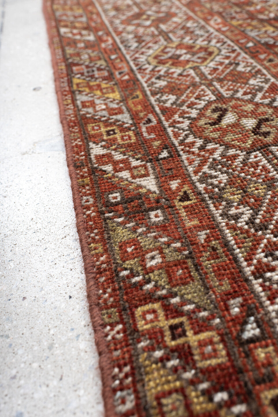7' x 10' one-of-a-kind handmade antique Shiraz large size rug. Color palette: rust, ivory, brown, terra cotta, charcoal