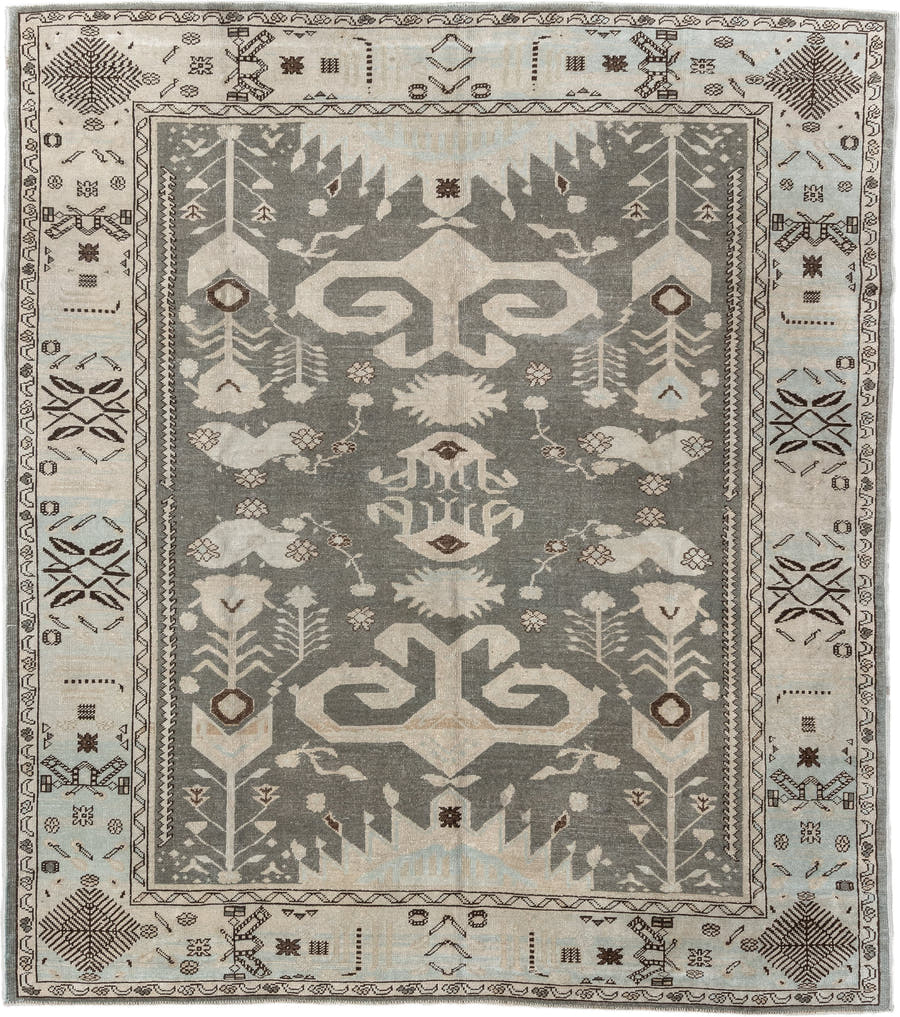 7' x 9' one-of-a-kind handmade vintage Anatolian rug. Color palette: charcoal, ivory, pale blue, taupe, brown, black, gray