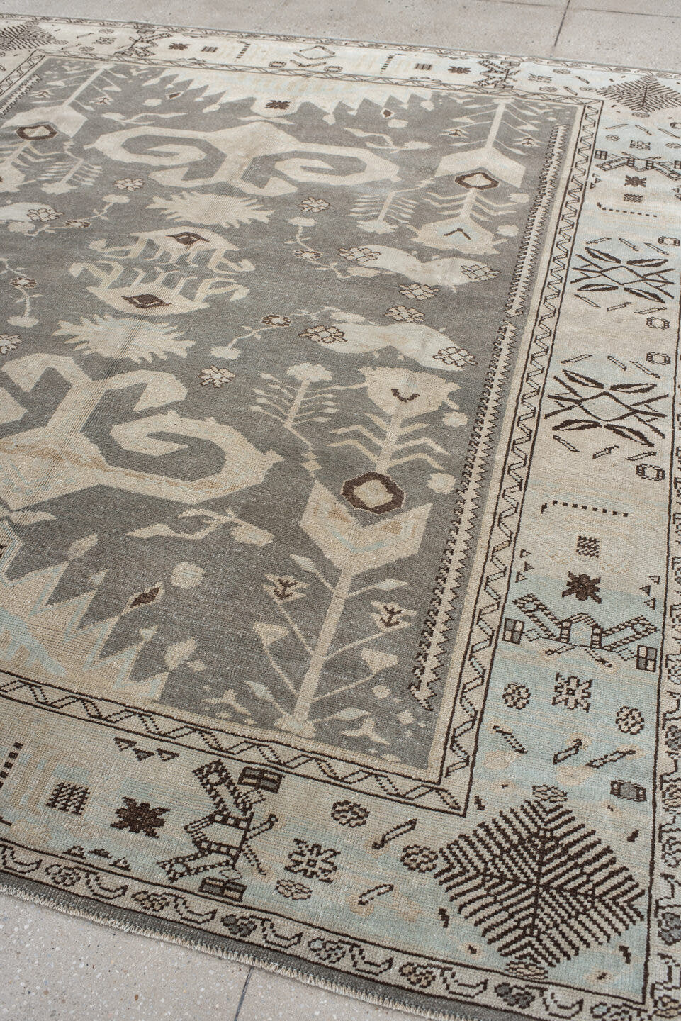7' x 9' one-of-a-kind handmade vintage Anatolian rug. Color palette: charcoal, ivory, pale blue, taupe, brown, black, gray
