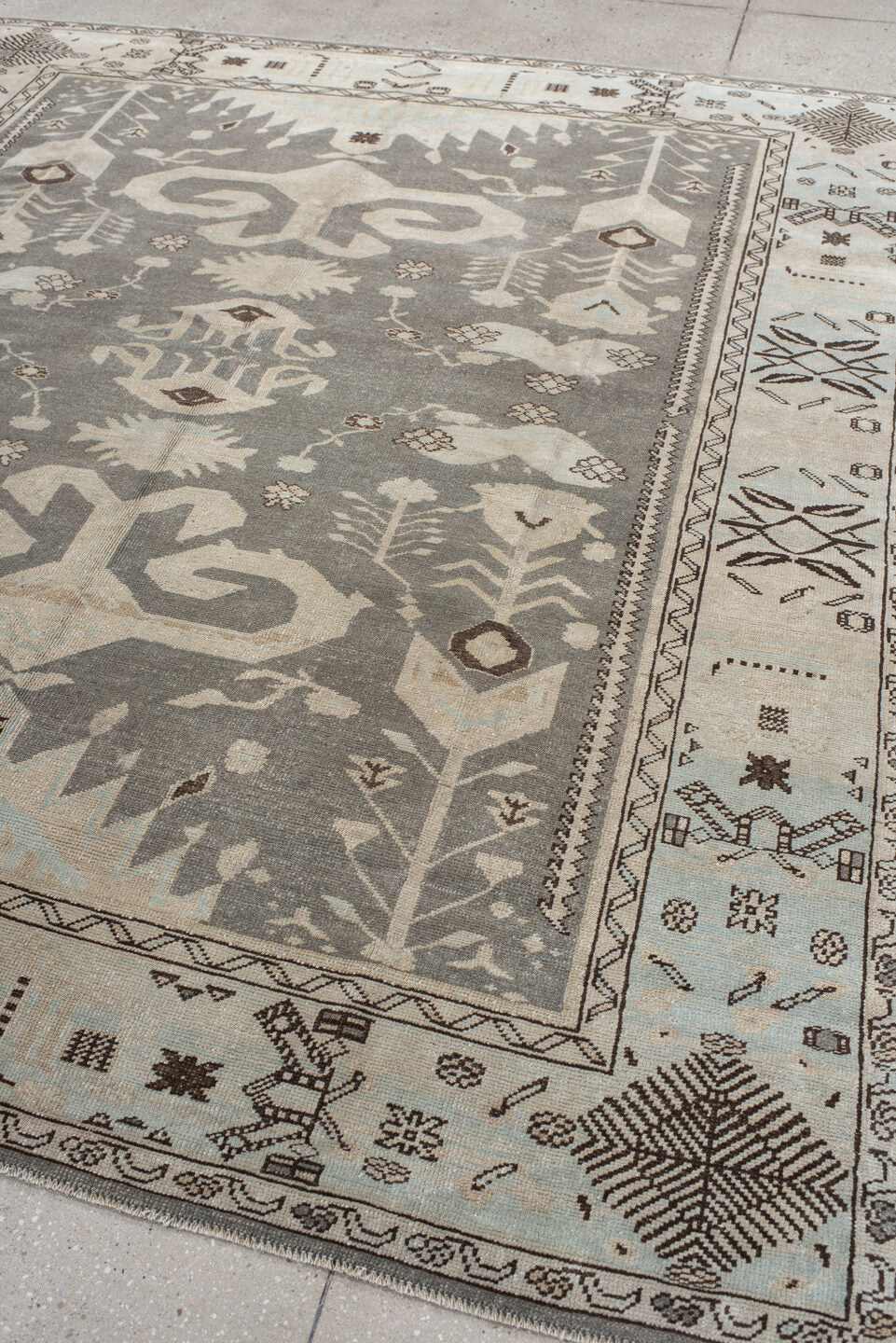 7' x 9' one-of-a-kind handmade vintage Anatolian rug. Color palette: charcoal, ivory, pale blue, taupe, brown, black, gray