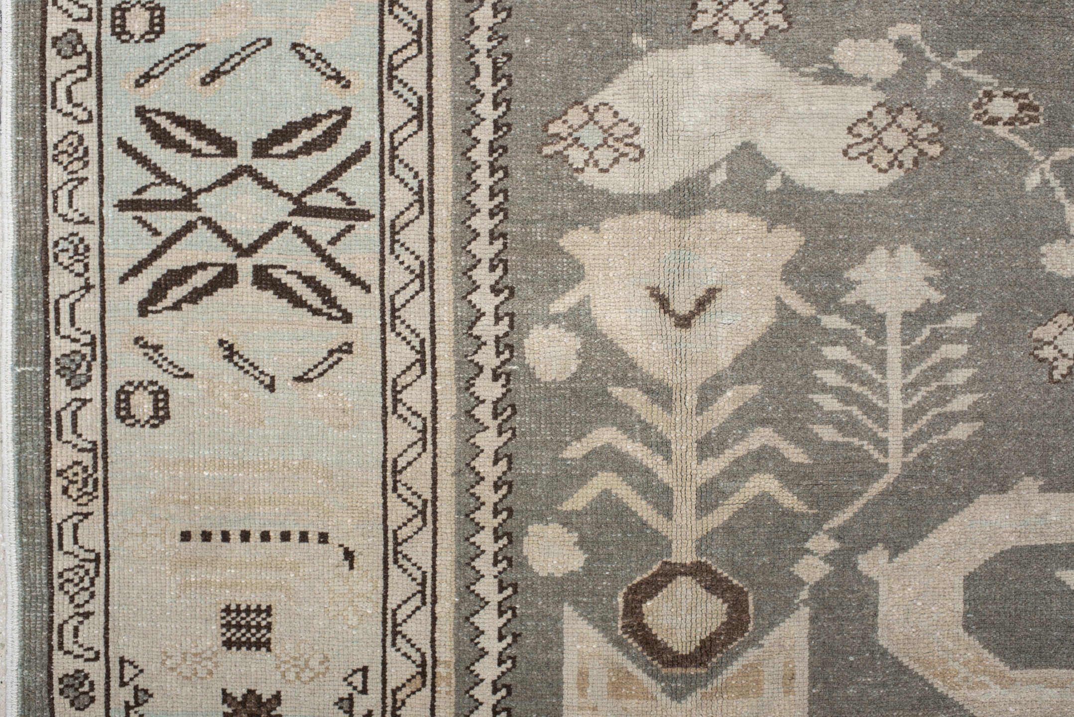 7' x 9' one-of-a-kind handmade vintage Anatolian rug. Color palette: charcoal, ivory, pale blue, taupe, brown, black, gray