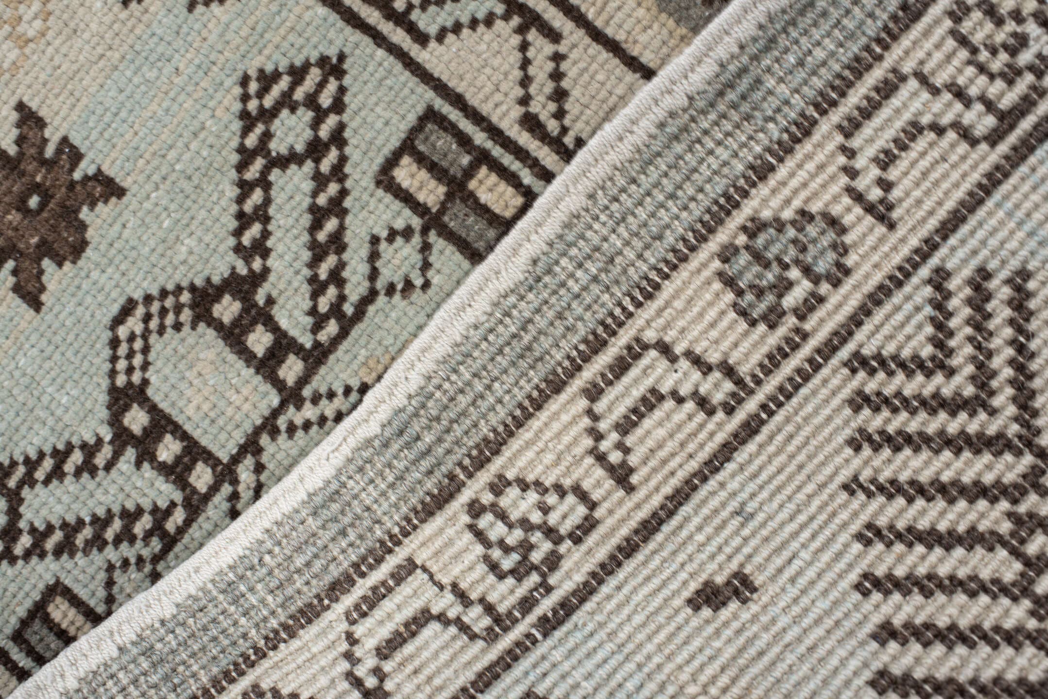 7' x 9' one-of-a-kind handmade vintage Anatolian rug. Color palette: charcoal, ivory, pale blue, taupe, brown, black, gray