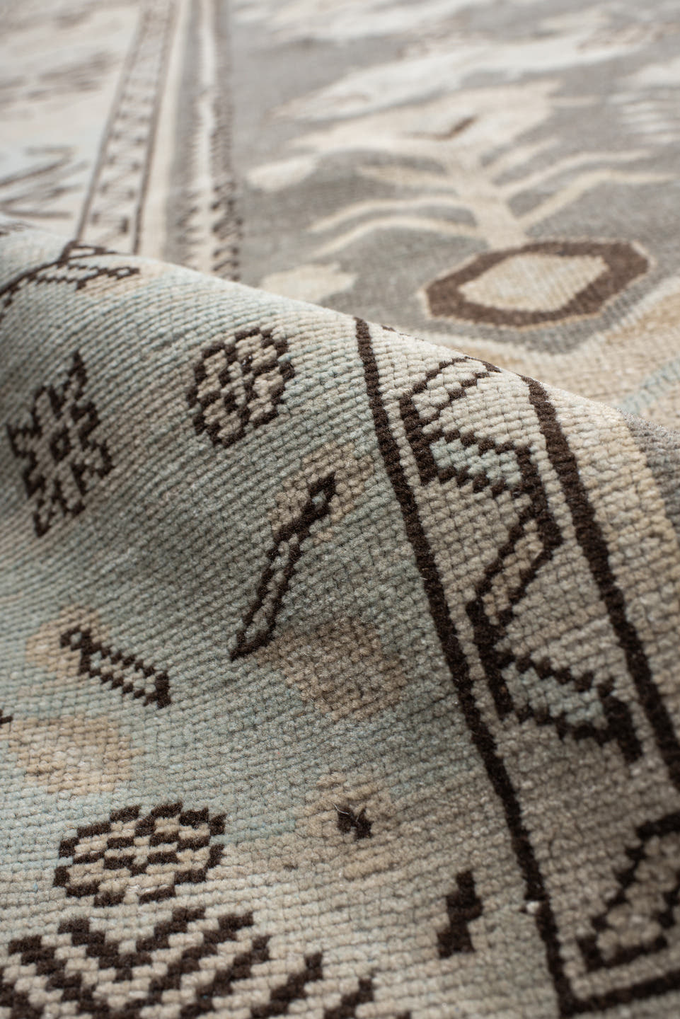 7' x 9' one-of-a-kind handmade vintage Anatolian rug. Color palette: charcoal, ivory, pale blue, taupe, brown, black, gray