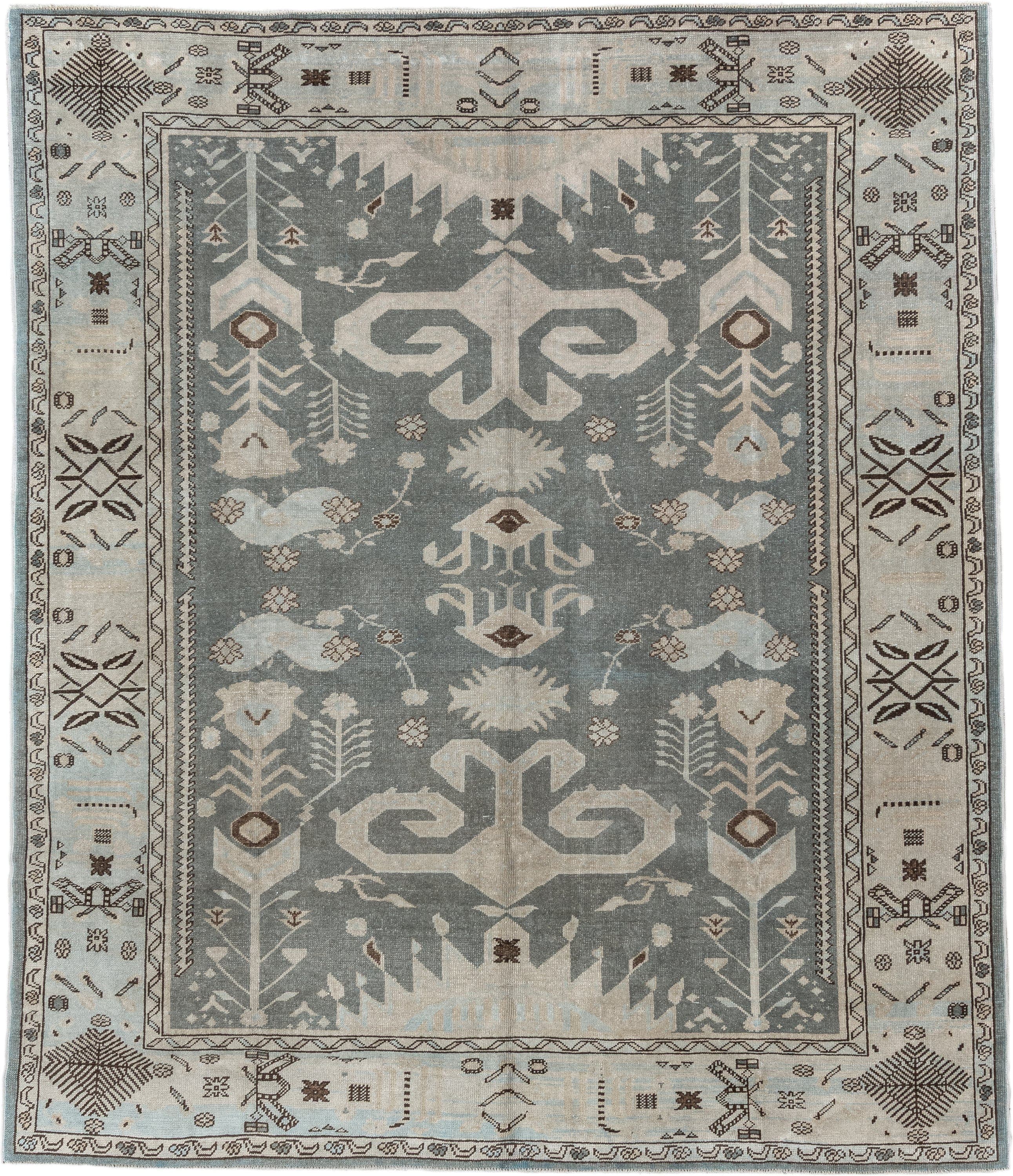 7' x 9' one-of-a-kind handmade vintage Anatolian rug. Color palette: ivory, slate, taupe, charcoal, brown, pale blue, gray