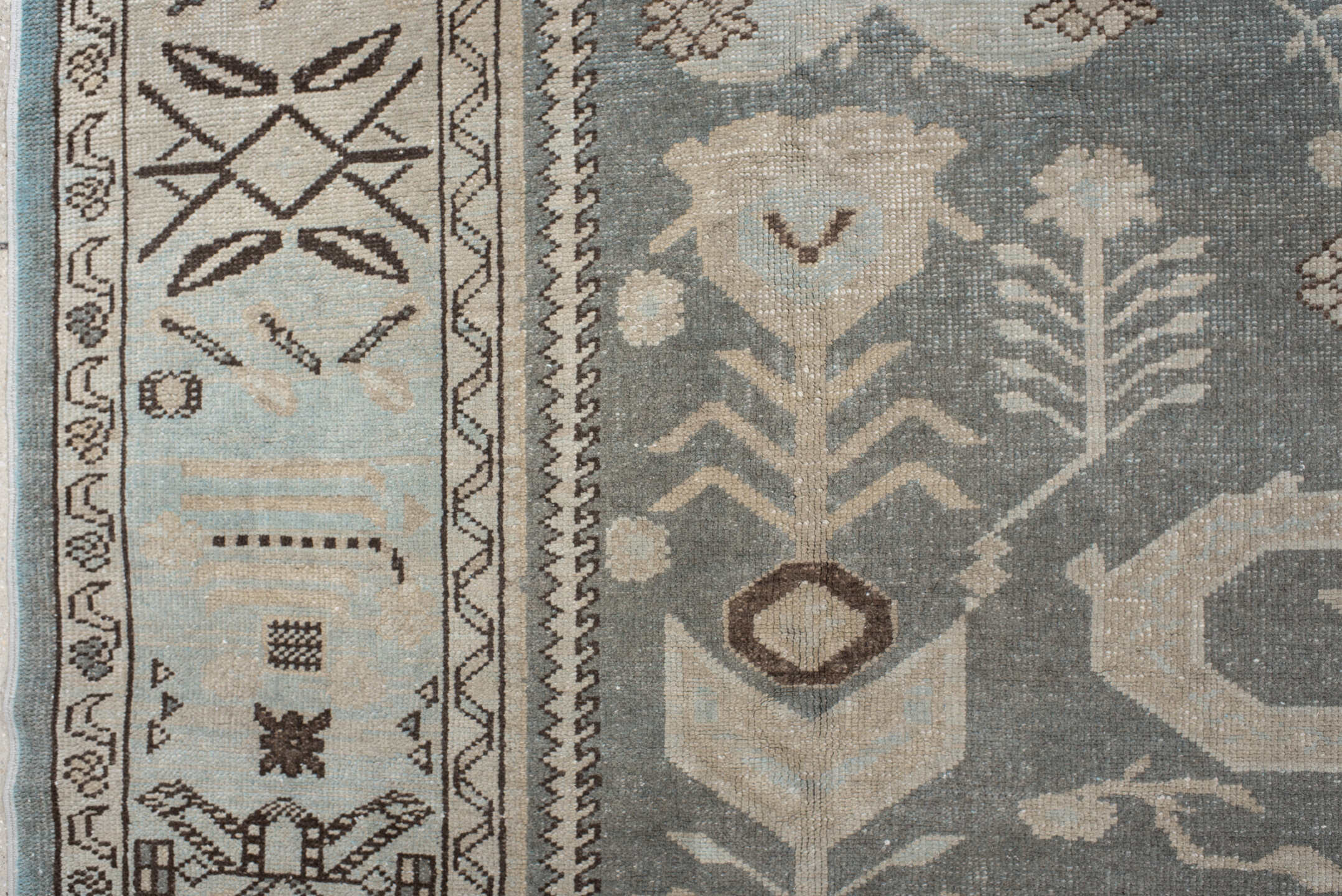 7' x 9' one-of-a-kind handmade vintage Anatolian rug. Color palette: ivory, slate, taupe, charcoal, brown, pale blue, gray