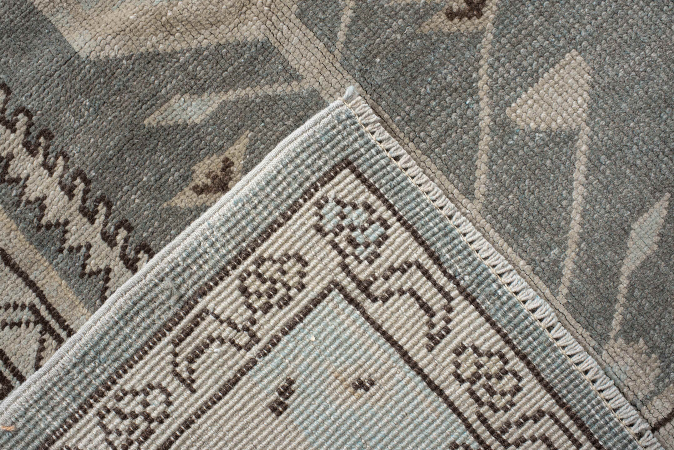 7' x 9' one-of-a-kind handmade vintage Anatolian rug. Color palette: ivory, slate, taupe, charcoal, brown, pale blue, gray