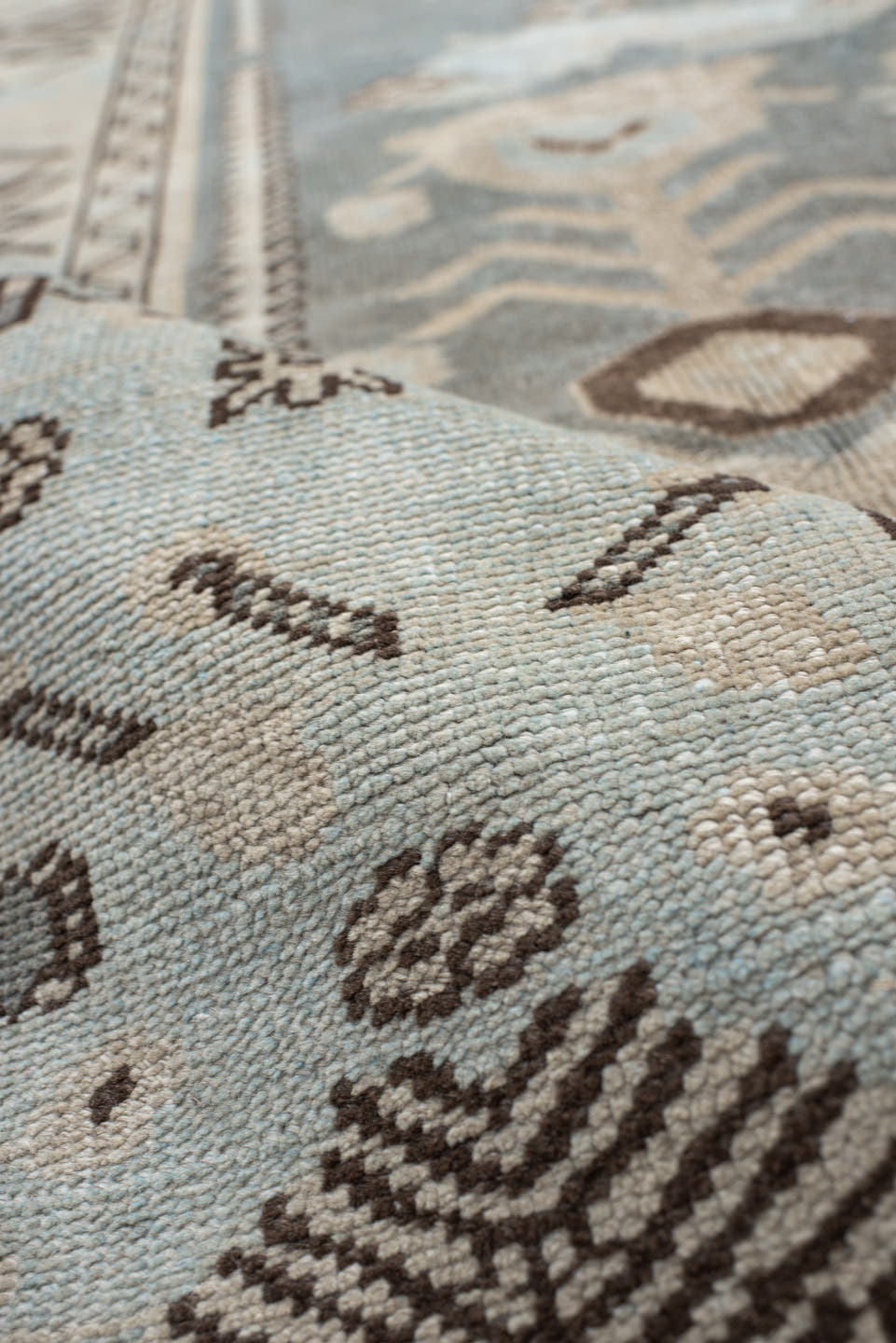 7' x 9' one-of-a-kind handmade vintage Anatolian rug. Color palette: ivory, slate, taupe, charcoal, brown, pale blue, gray