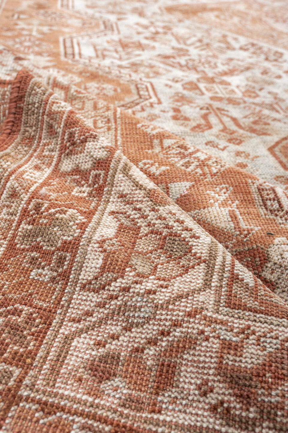 7' x 10' one-of-a-kind handmade antique Shiraz large size rug. Color palette: terra cotta, ivory, rose, rust, camel