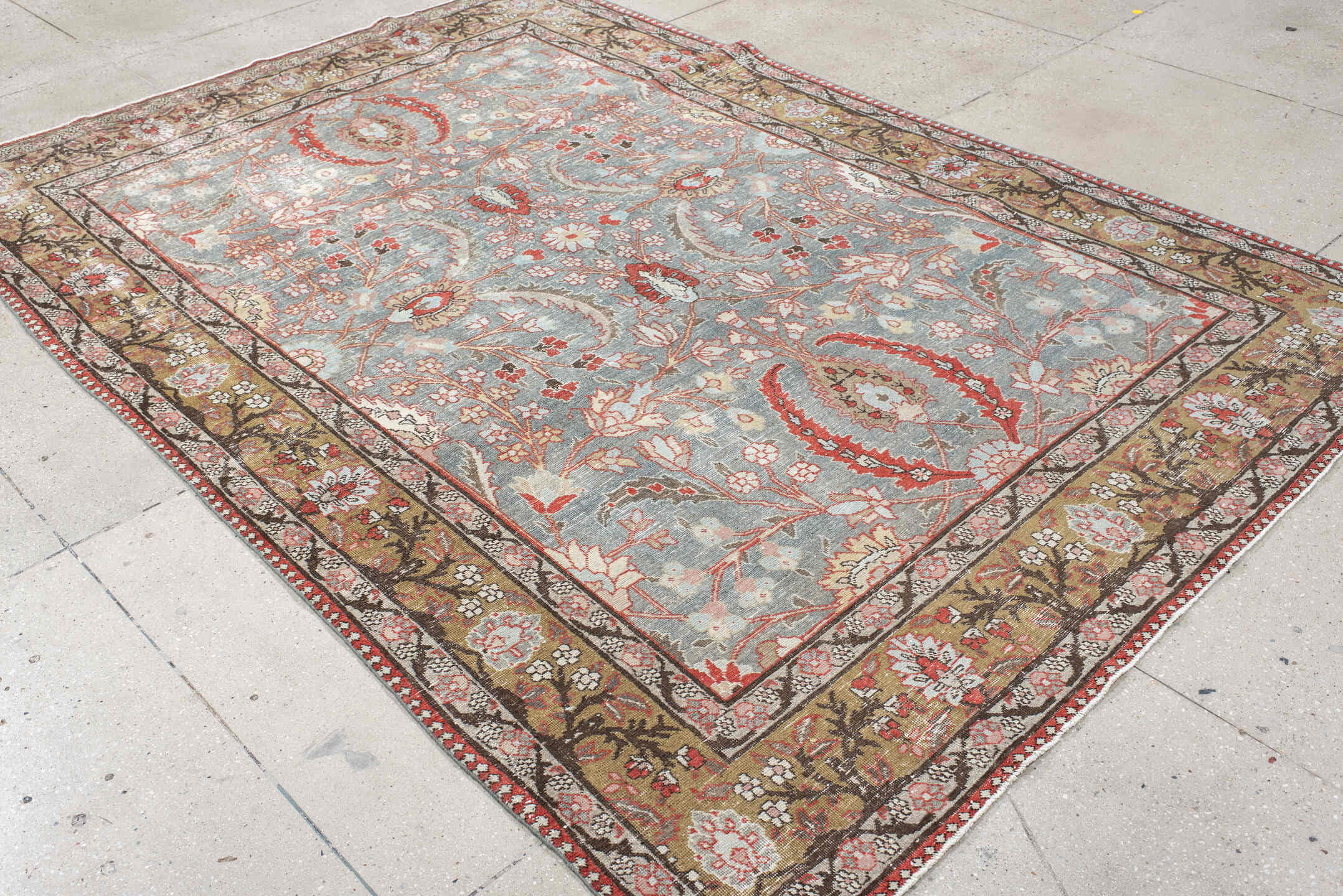6' x 9' one-of-a-kind handmade antique Tabriz medium size rug. Color palette: light blue, camel, ivory, rust, brown, coral