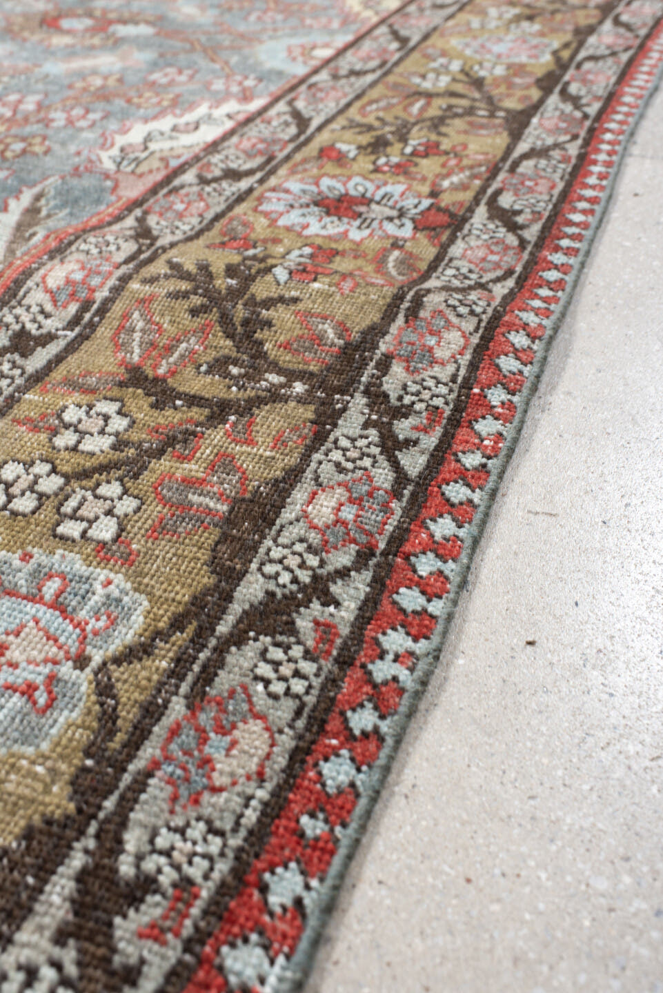 6' x 9' one-of-a-kind handmade antique Tabriz medium size rug. Color palette: light blue, camel, ivory, rust, brown, coral