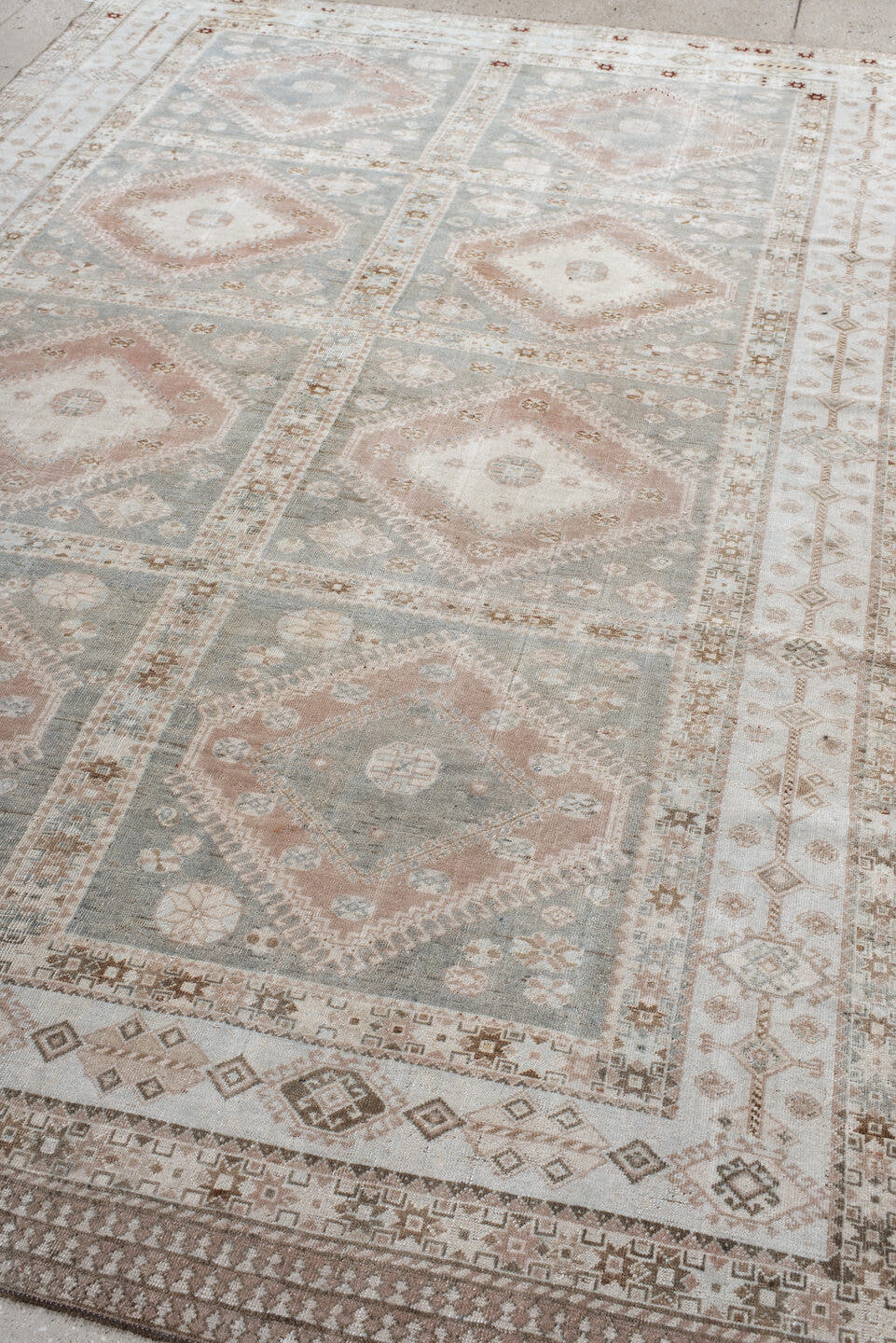 6' x 9' one-of-a-kind handmade antique Shiraz medium size rug. Color palette: ivory, blue_gray, blush, taupe, camel, rust