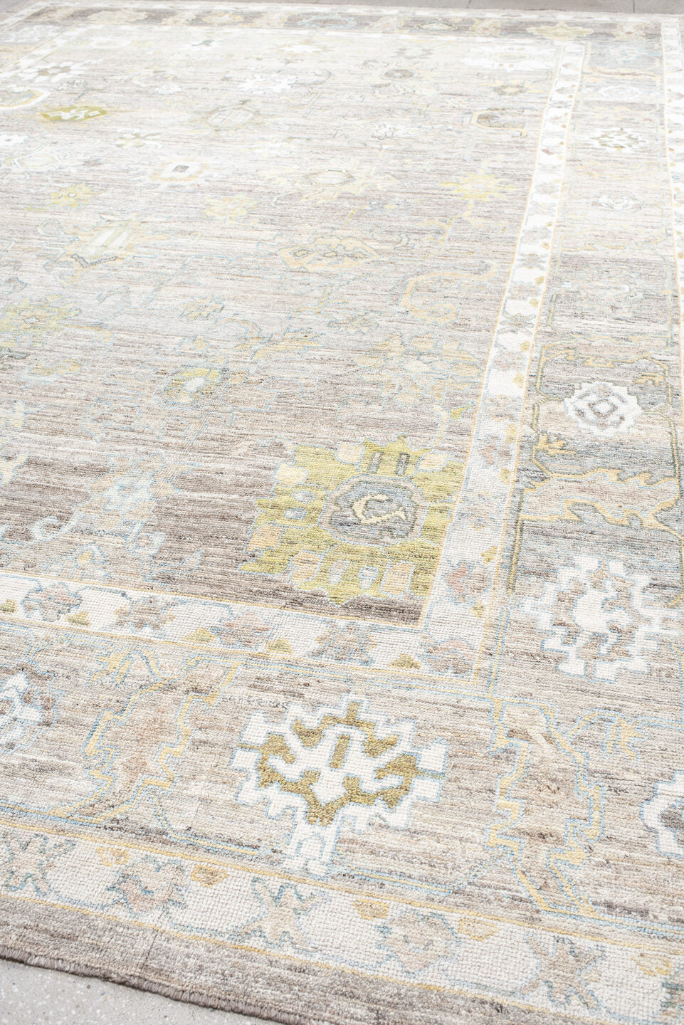 13' x 19' one-of-a-kind handmade vintage Oushak oversize rug. Color palette: taupe, ivory, light_blue, sage, gold, gray