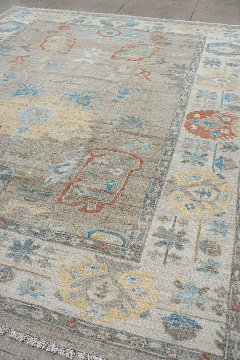 10' x 12' one-of-a-kind handmade vintage Oushak large size rug. Color palette: taupe, ivory, sky blue, sage, coral, gold