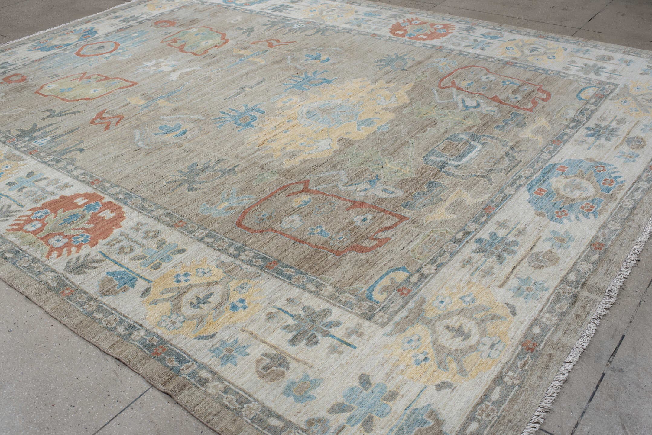 10' x 12' one-of-a-kind handmade vintage Oushak large size rug. Color palette: taupe, ivory, sky blue, sage, coral, gold