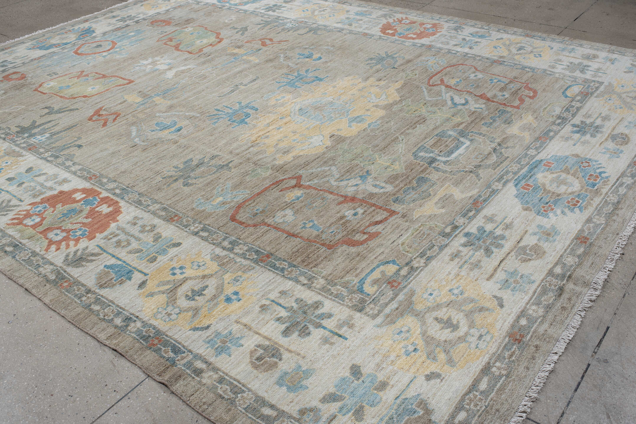 10' x 12' one-of-a-kind handmade vintage Oushak large size rug. Color palette: taupe, ivory, sky blue, sage, coral, gold