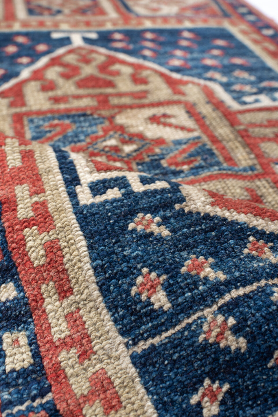 1' x 3' one-of-a-kind handmade vintage Anatolian small size rug. Color palette: navy, ivory, rust, brick, cream, blue