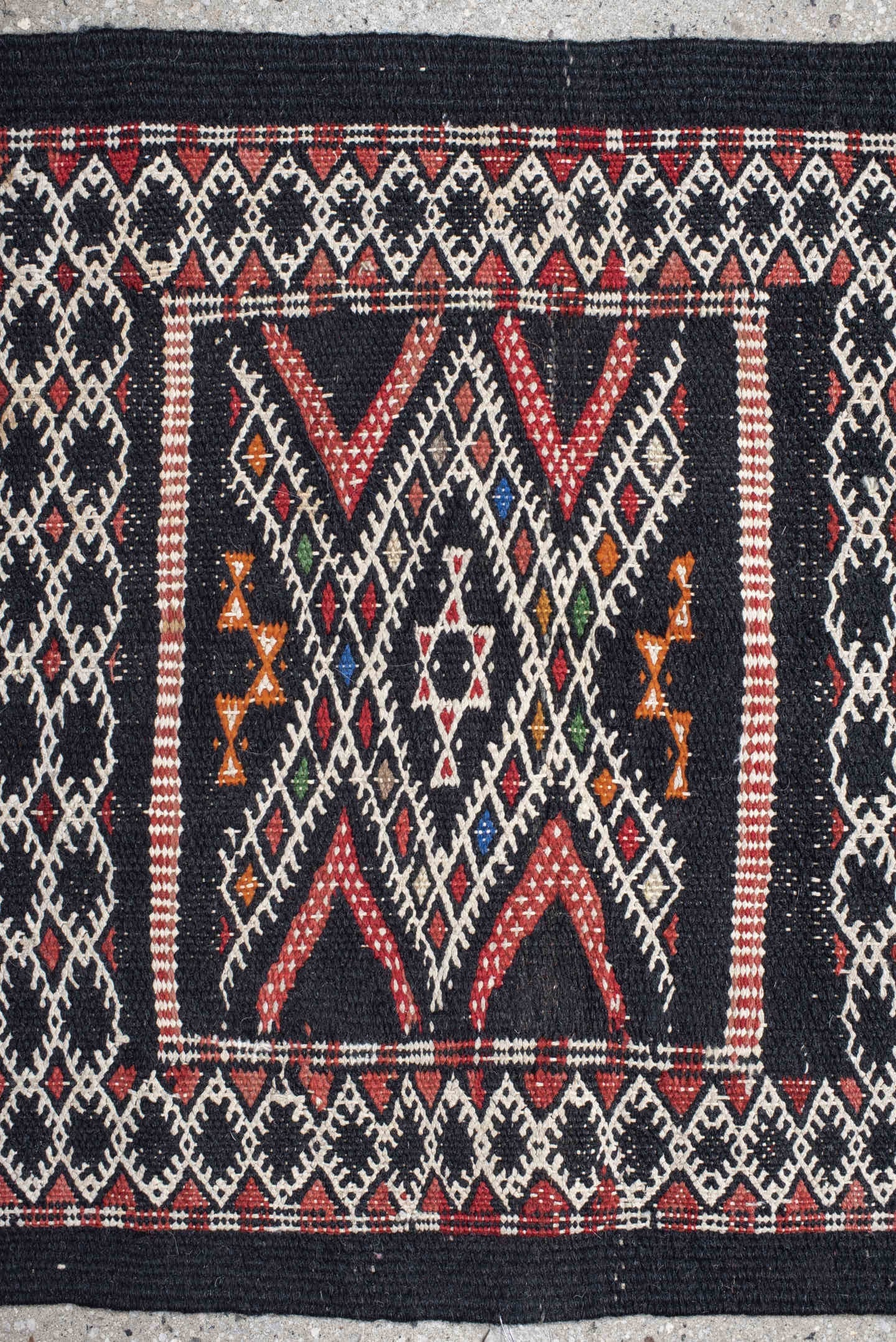 1' x 1' one-of-a-kind handmade vintage Jijim small size rug. Color palette: charcoal, ivory, rust, crimson, orange, blue