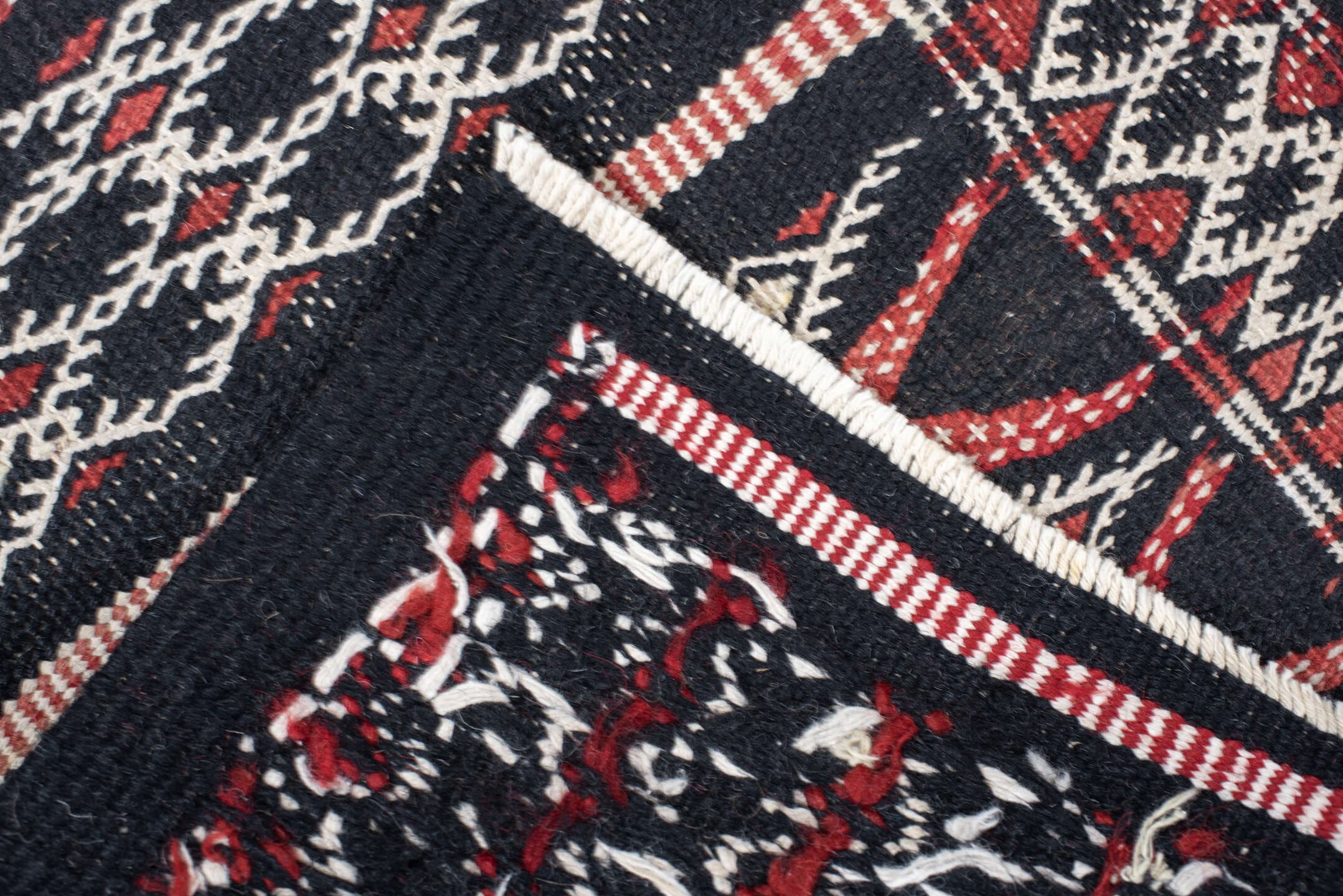 1' x 1' one-of-a-kind handmade vintage Jijim small size rug. Color palette: charcoal, ivory, rust, crimson, orange, blue