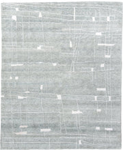 8' x 10' one-of-a-kind handmade vintage Tribeca large size rug. Color palette: pale blue, ivory, silver, mist, light blue