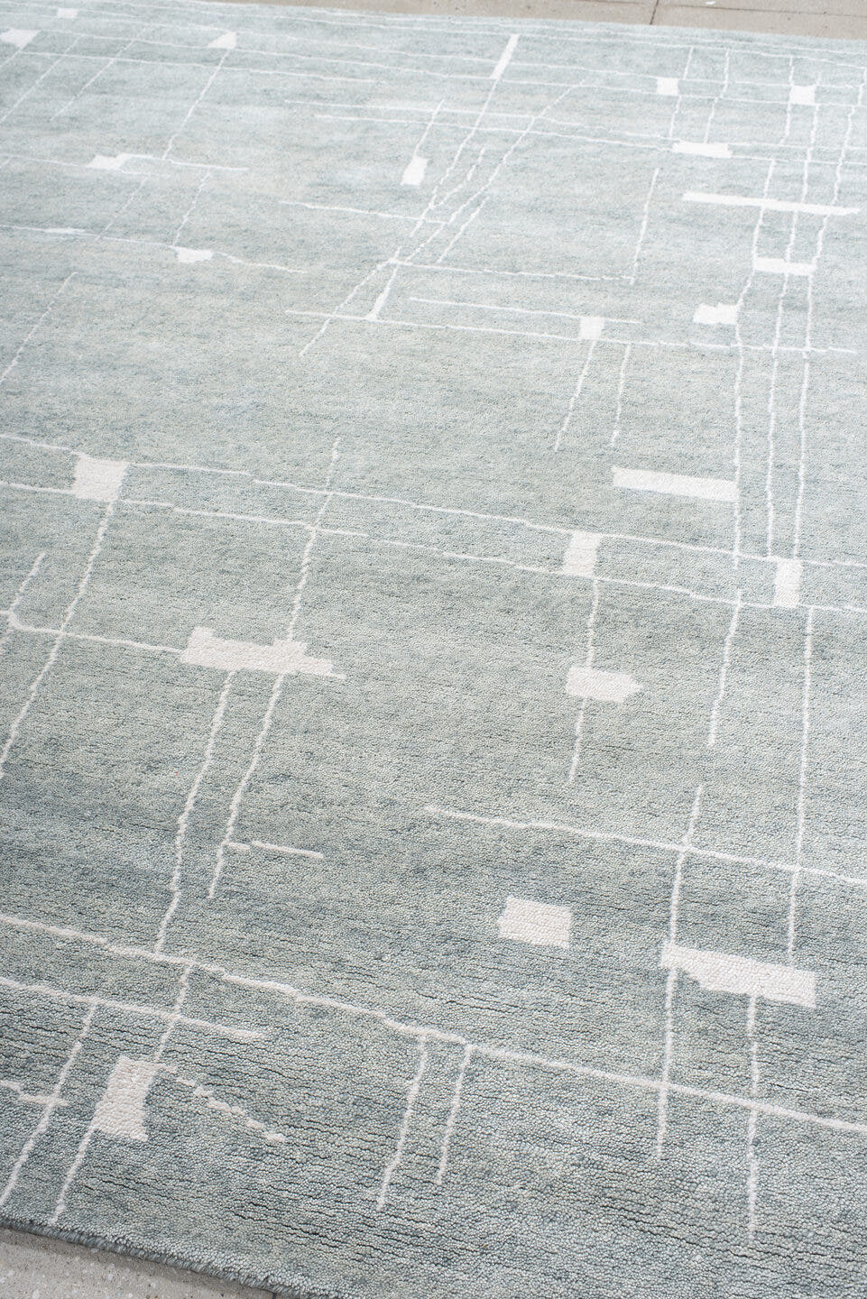 8' x 10' one-of-a-kind handmade vintage Tribeca large size rug. Color palette: pale blue, ivory, silver, mist, light blue