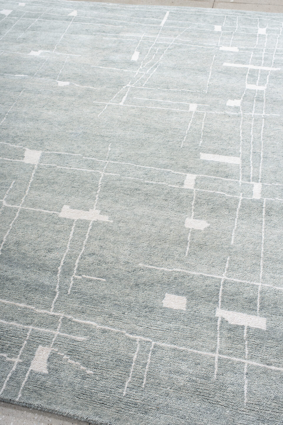 8' x 10' one-of-a-kind handmade vintage Tribeca large size rug. Color palette: pale blue, ivory, silver, mist, light blue